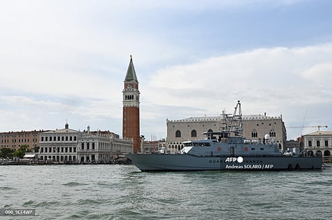 An Italian Guardia di Finanza ship patrols on the Grand Canal in front of Piazza San Marco, a day before G20 finance ministers and central bankers meet, in Venice on 8 July 2021.