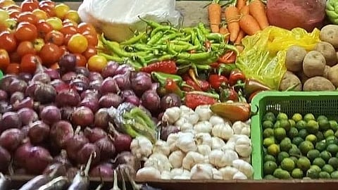 A vendor of vegetables at Metro Taguig Wet and Dry Market is seen on a regular day.
