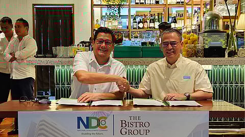 From left: National Development Company general manager Anton Mauricio and The Bistro Group president Jean Paul Manuud during the signing of a commercial lease agreement.