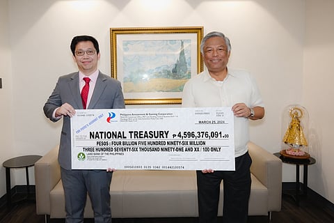 PAGCOR chairman and CEO Alejandro H. Tengco (right) hands over a facsimile check to Deputy National Treasurer Eduardo Anthony Mariño III during yesterday’s simple dividend turnover ceremony at the new PAGCOR Corporate Office in Pasay City. The check amounting to nearly P4.6 billion is the agency’s latest cash dividend to the government and represents 75 percent of PAGCOR’s net earnings in calendar year 2023. The turnover is also in accordance with Republic Act 7656 or the Dividend Law mandating government-owned and controlled corporations to remit part of their earnings to the Treasury.