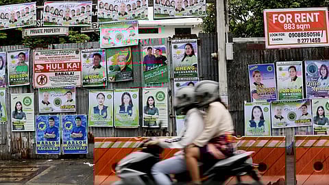 (FILES) Barangay Candidates start hanging a tarpaulin campaign in Quezon, on Thursday 19 October 2023.