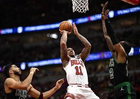 CHICAGO, ILLINOIS - MARCH 23: DeMar DeRozan #11 of the Chicago Bulls shoots in the second half against the Boston Celtics at the United Center on 23 March 2024 in Chicago, Illinois.