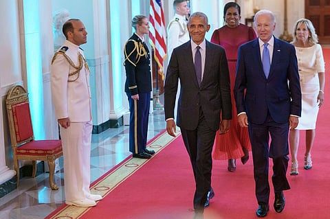 Former US President Barack Obama and US President Joe Biden, followed by former US First Lady Michelle Obama and US First Lady Jill Biden, arrive for a ceremony to unveil the Obama's official White House portraits, in the East Room of the White House in Washington, DC, on 7 September 2022.