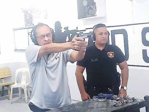 JUDGE Jimmy Santiago (left) sent a lot of criminals scampering (or to meet their Maker) with his true aim. At the Manila Police District’s newly renovated SWAT firing range, Santiago is assisted by present SWAT chief P/Capt. Leo So in hitting the Alpha.