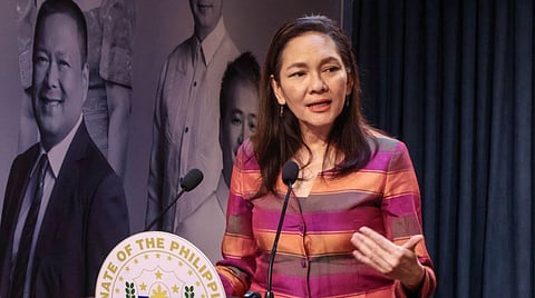 Senator Risa Hontiveros standing on a podium speaking