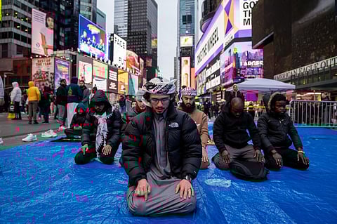 Members of the Muslim community gather at Times Square for the first Tarawih prayer of Ramadan on 10 March 2024 in New York City. Ramadan is observed by Muslims worldwide and is regarded as a commemoration of Muhammad's first revelation. The annual observance of Ramadan is celebrated by fasting until sunset each day (sawm), and prayer (salah).