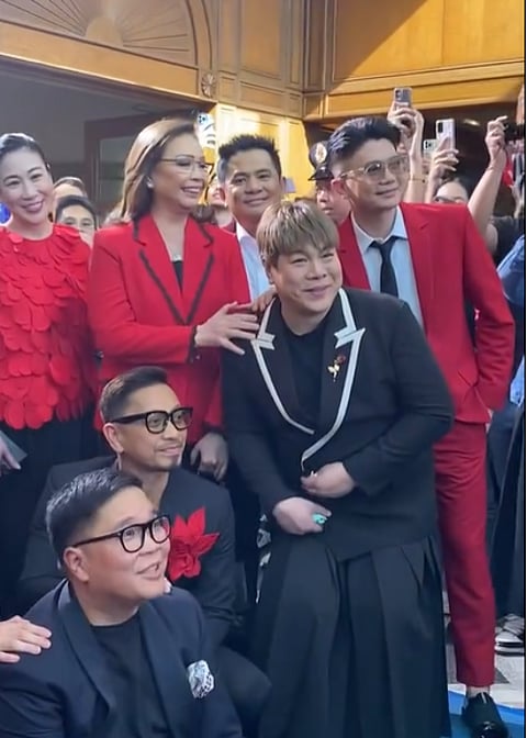 GMA Network's Annette Gozon-Valdes (left) standing beside ABS-CBN's Cory Vidanes with some It's Showtime hosts.