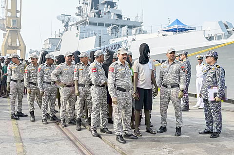 ACCUSED Somali pirates escorted by soldiers wait to board a police van at the Indian naval dockyard in Mumbai on 23 March 2024. The pirates were apprehended when naval commandos recaptured a hijacked bulk carrier and rescued several hostages.