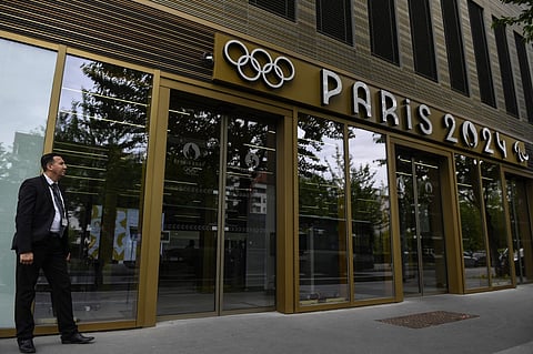A security member stands at the entrance of the headquarters of the Paris 2024 Olympics (Cojo) headquarters.