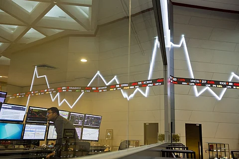 (FILES) An employee monitors share prices at the Jakarta Stock Exchange on 29 September 2015.