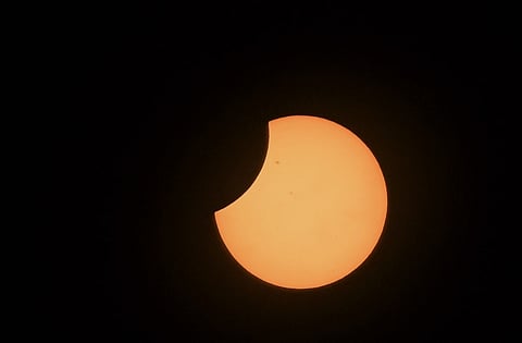 (FILES) The moon crosses in front of the sun during the annular solar eclipse in Bogota on 14 October 2023.