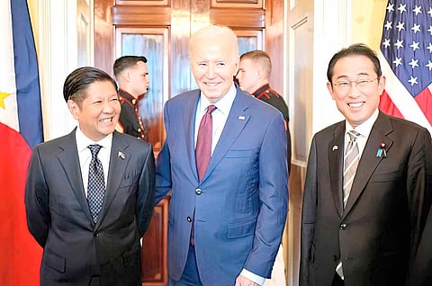 Meeting of minds US President Joe Biden heads to a trilateral meeting with Japanese Prime Minister Fumio Kishida (right) and Philippine President Ferdinand Marcos Jr. (left) at the White House in Washington, D.C. on 11 April.