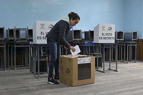 A woman casts her vote at a polling station during a referendum on tougher measures against organized crime in Quito on 21 April 2024. Ecuadorans began voting Sunday in a referendum on proposed tougher measures to fight gang-related crime. The once-peaceful South American country has been grappling with a shocking rise in violence that has seen two mayors killed this week.