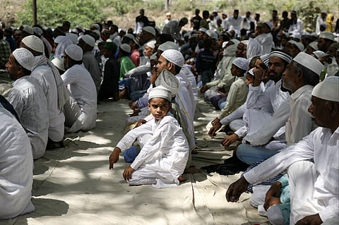 Muslim devotees gather to offer their last Friday noon prayers during the Islamic holy fasting month of Ramadan in Varanasi on 5 April 2024.