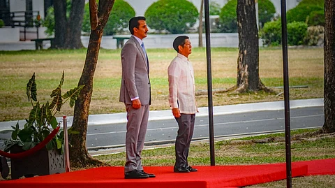 President Ferdinand Romualdez Marcos Jr. welcomes Sheikh Tamim bin Hamad Al Thani, Emir of Qatar, during an arrival honors ceremony at the Kalayaan Grounds in Malacanang Palace in Manila on 22 April 2024. 