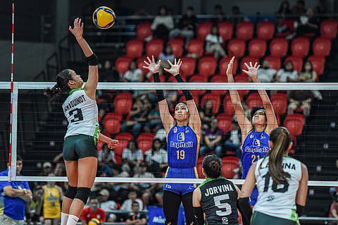 CAMILLE Victoria of Nxled attacks the defense of Jorelle Singh and Shirley Salamagos of Capital1 during their PVL All-Filipino Conference match yesterday. The Chameleons prevailed, 25-13, 25-23, 25-22.