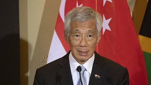 (FILES) Singapore's Prime Minister Lee Hsien Loong speaks at a press conference during his visit to the South African Parliament in Cape Town on 16 May 2023.