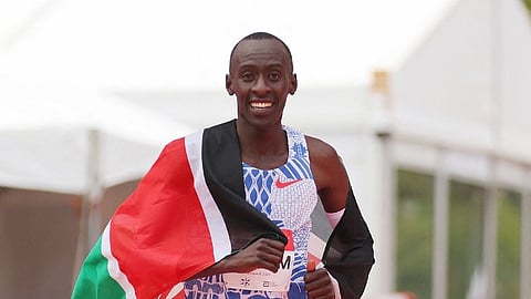 (FILES) Kelvin Kiptum of Kenya celebrates after winning the 2023 Chicago Marathon professional men's division and setting a world record marathon time of 2:00.35 at Grant Park on 8 October 2023 in Chicago, Illinois.