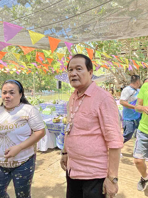 Malay Mayor Frolibar Bautista, wearing a pink polo.