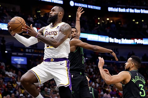 LEBRON James muscles his way to a triple-double performance to power the Los Angeles Lakers to a 124-108 win over the New Orleans Pelicans in the final day of the NBA regular season.