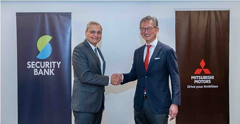 Security Bank president and CEO Sanjiv Vohra (left) and Mitsubishi Motors vice president Tatsuo Nakamura seal the agreement to offer auto loans under Mitsubishi Motors Finance Philippines.
