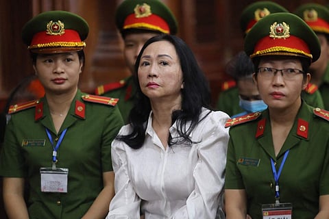 Vietnamese property tycoon Truong My Lan (C) looks on at a court in Ho Chi Minh city on April 11, 2024. — A top Vietnamese property tycoon was sentenced to death on Thursday in one of the biggest corruption cases in history, with an estimated $27 billion in damages.