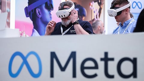 (FILES) Visitors test Meta Quest 3 goggles at the booth of Meta Platforms at the Hanover Technology Fair on 22 April 2024 in Hanover, northern Germany.