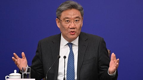 (FILES) China's Minister of Commerce Wang Wentao answers a question at a press conference during the second session of the 14th National People's Congress (NPC) in Beijing on 6 March 2024.