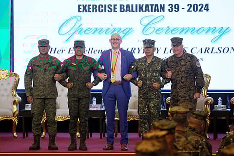 MGen Marvin L. Licudine PA, PH Exercise Director, and Gen Romeo S. Brawner Jr. PA, Chief of Staff, Armed Forces of the Philippines (AFP), along with U.S. Embassy Chargé d'Affaires Robert Ewing, MGen Noel D. Beleran PN(M), and LT Gen William M. Jurney USMC, US Exercise Director, linked arms Monday 22 April during the opening of the Philippines-United States Exercise Balikatan 39-2024 at the AFPCOC at Camp Aguinaldo in Quezon City. This marks the 39th iteration of Balikatan, the largest annual bilateral training exercise between the two Allies, running from 22 April to 10 May 10.
