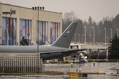 EVERETT, WA - 22 February: Workers stand outside of Boeing's airplane production facility on 22 February 2021 in Everett, Washington. Following Saturday's engine failure on a Boeing 777 over Denver, the FAA issued an emergency inspection order for Boeing 777 aircraft with Pratt & Whitney engines.