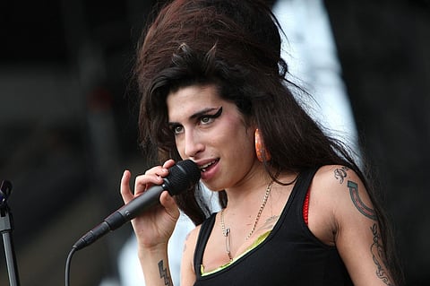 (FILES) Singer Amy Winehouse performs onstage at the Virgin Festival By Virgin Mobile 2007 at Pimlico Race Course on 4 August 2007 in Baltimore, Maryland.