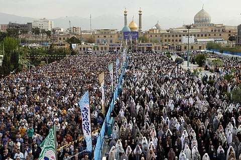 Men and women attend the morning prayer separately in Shahr-e-Rey (Rey) on the southern outskirts of the Iranian capital Tehran, as Muslims across the world celebrated on April 10, 2024 Eid al-Fitr, which marks the end of the holy fasting month of Ramadan.
