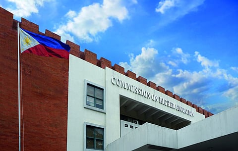 Commission on Higher Education(CHED) Building and a Philippines flag raised.