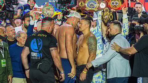 Britain's Tyson Fury (L) and Ukraine's Oleksandr Usyk (R) stare each other down during the official weigh-in on the eve of their heavyweight world boxing championship fight in Riyadh on 17 May 2024.