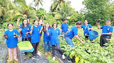 SM beneficiary-farmers from Legazpi, Albay, and the fruits of their labor.