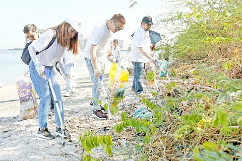 Pepsico Philippines and HOPE volunteers clean up the Las Piñas-Parañaque Wetland Park.