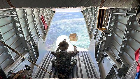 A marine aboard the Philippine Air Force NC212i