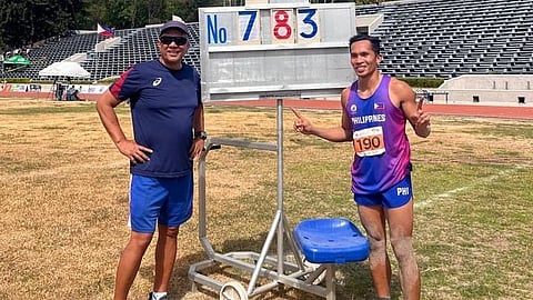 JANRY Ubas and his coach, Dario de Rosas, celebrate after winning the gold medal in the men’s long jump event of the Philippine Athletics Championships.