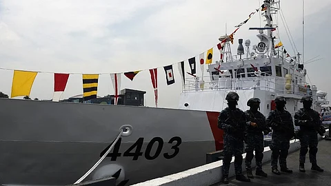 (FILES) Members of the Philippine Coast Guard anti-terrorism unit stand next to the newly commissioned Coast Guard's Multi-Role Response Vessel (MRRV) BRP Malapascua during a ceremony at the Coast Guard headquarters in Manila on 7 March 2017.