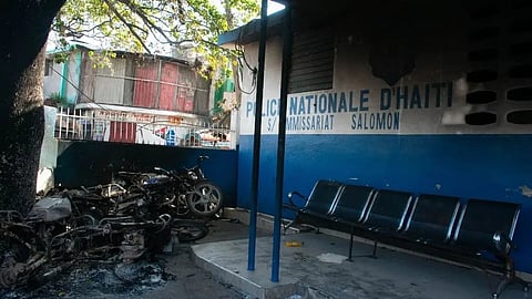 A police station is damaged by armed gang members in Port-au-Prince, Haiti, March 7, 2024. Haiti's troubled capital was put under a state of emergency for another month on March 7 as authorities struggle to rein in violent gangs demanding the prime minister resign. The decree, published in the official gazette, came as the gangs -- who already rule significant parts of Port-au-Prince -- extended their control with further attacks on law enforcement. clarens