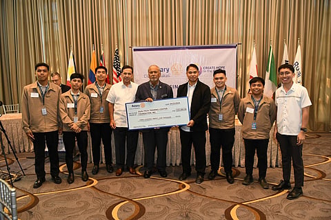Rotary Club of Makati president Bing Matoto (5th from left) presents Jefferson Gonzales, head of Placement for Dualtech (6th from left), with a cheque for P325,000. The amount is the peso equivalent of US$5,900, the sum total which includes the Rotary Club of Taoyuan's $2,500 donation to Dualtech and the amount matched by RC Makati. Donation recipient Dualtech is a non-profit technical vocational school preparing young people for employment in industrial firms. Others in the photo are RC Makati director Rodrigo Segura and Dualtech scholars.