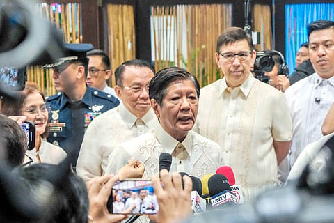 PRESIDENT Ferdinand Marcos Jr. fields questions from reporters Monday at the sidelines of the Government Owned and Controlled Corporations Day in Pasay City. Marcos said the Philippines would not resort to using water cannons against China in the West Philippine Sea.