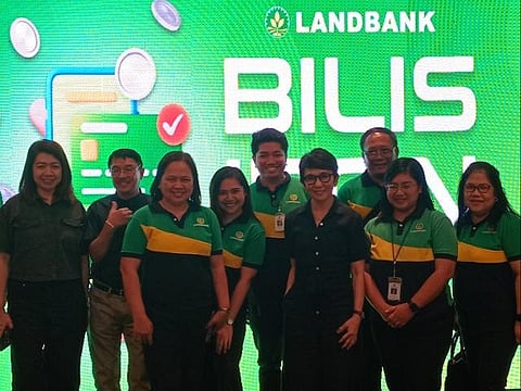 LandBank president and CEO Lynette Ortiz (center, in black outfit), leads the financial inclusion drive of the state bank.