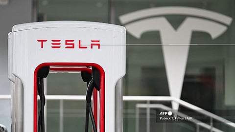 (FILES) A Tesla electric vehicle charging stall stands at a Tesla Supercharger location in Santa Monica, California on 15 May 2024.