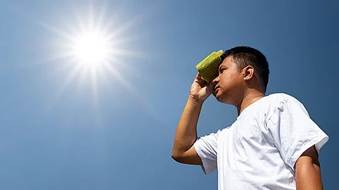 (FILES) A man is enduring the scorching heat of the sun.