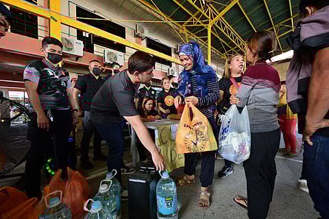 Davao fire victims get relief, cash assistance