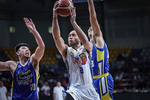 Kelly Williams flashes his old, fiery form in leading TNT past Magnolia, 98-93, Sunday in the PBA Philippine Cup at the Ninoy Aquino Stadium.