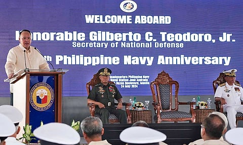 Navy Flag Officer in Command Toribio Adaci Jr., AFP Chief of Staff General Romeo Brawner Jr., and Defense Secretary Gilberto Teodoro Jr. (at rostrum) lead the celebration of the Philippine Navy's 126th founding anniversary on Friday, 24 May at the Philippine Navy headquarters in Manila.