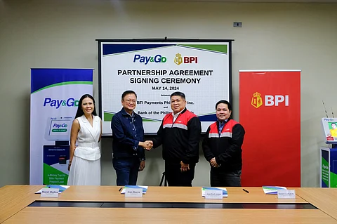 FROM left: BTI Payments chief commercial Officer Mariel Medina, BTI Payments chief executive officer Dan Ibarra, BPI senior vice president and Head of Agency Banking Rally Jereza, and BPI vice president and head of product management Bong Lualhati commemorate their partnership in a signing ceremony.
