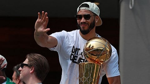 JAYSON Tatum lifts the Larry O’Brien trophy during the Boston Celtics’ championship parade in Boston, Massachusetts.